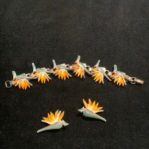 Ming’s of Honolulu Birds of Paradise Ivory bracelet and earrings set.